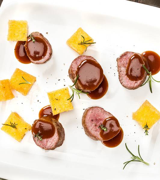 Lamb loin chops, fried polenta and tomato reduction