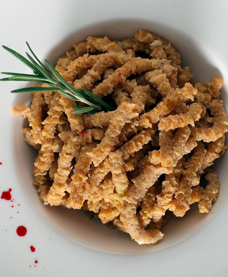 Spelt Tomato-flavoured Passatelli sautéed in clarified butter and basil