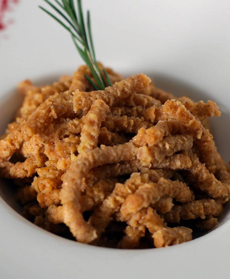 Spelt Tomato-flavoured Passatelli sautéed in clarified butter and basil