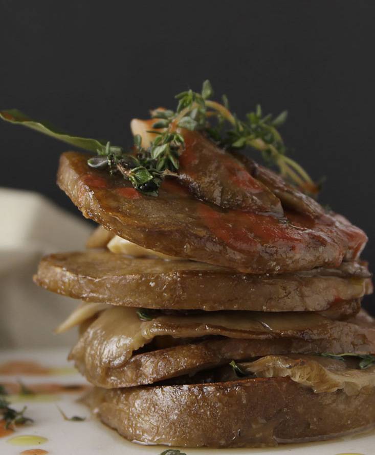 Seitan and grilled finferli mushrooms with tomato juice reduction