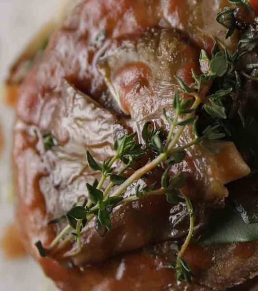Seitan and grilled finferli mushrooms with tomato juice reduction